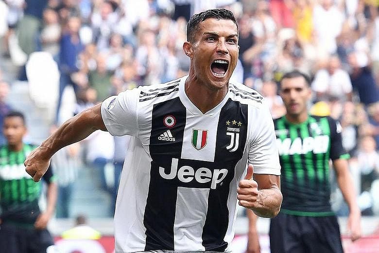A jubilant Cristiano Ronaldo after opening accounts for Juventus against Sassuolo in their Italian Serie A match in Turin on Sunday. He doubled his team's advantage before the visitors pulled a goal back but the win was marred by Douglas Costa's send