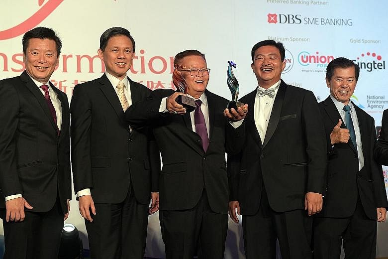 At last night's Singapore Heartland Enterprise Star Awards were (from left) Mr Goh Sin Teck, editor of Lianhe Zaobao and Lianhe Wanbao; Minister for Trade and Industry Chan Chun Sing; Poh Cheu Kitchen founder Neo Poh Cheu, the overall award winner in