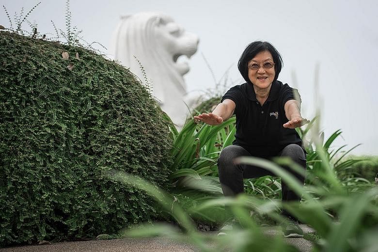 Mrs Lee Yen limbering up with squats and stretching exercises. The 67-year-old used to suffer from pain in her soles and kneecaps after brisk walking, but that eased after she took part in an exercise programme to help seniors build stronger muscles.