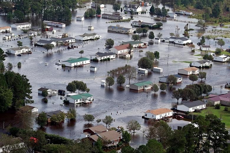 Flooded homes on the outskirts of Lumberton, North Carolina, on Monday. Hurricane Florence was downgraded to Category 1 when it ploughed ashore last Friday, but its sluggish pace resulted in record-breaking rainfall totals.