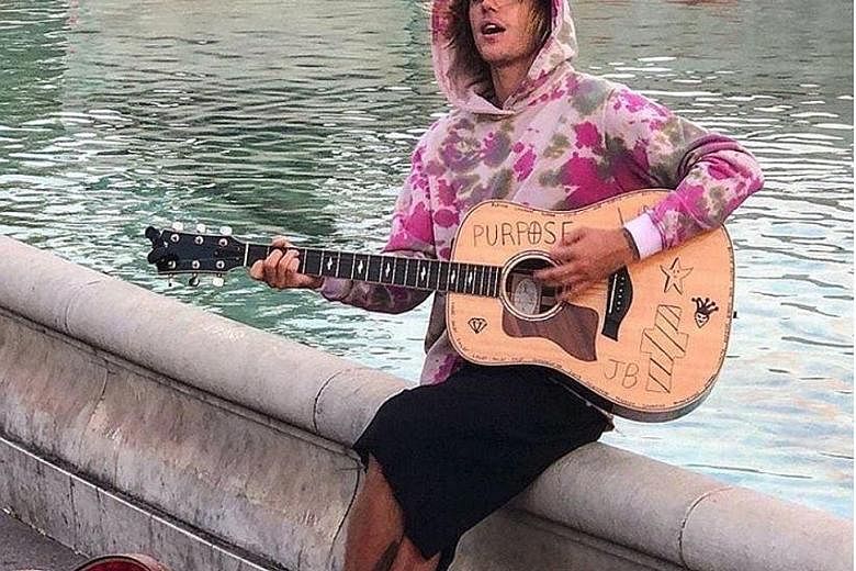 Singer Justin Bieber outside Buckingham Palace in London, serenading model Hailey Baldwin, whom he reportedly married in New York last Thursday.
