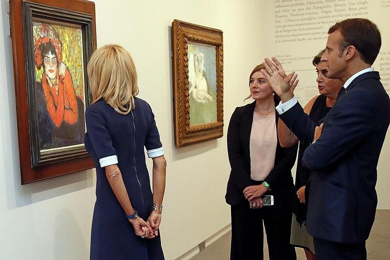 French President Emmanuel Macron and his wife Brigitte Macron (far left) at the Picasso: Blue And Rose exhibition at the Musee d'Orsay.