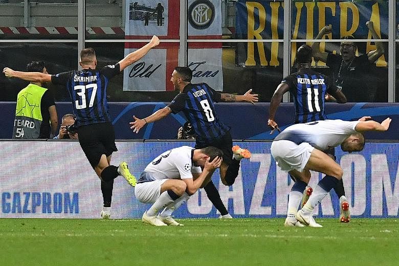 Inter Milan midfielder Matias Vecino celebrating with midfielder Milan Skriniar and striker Keita Balde after scoring a last-gasp winner against Tottenham for a 2-1 Champions League win on Tuesday.