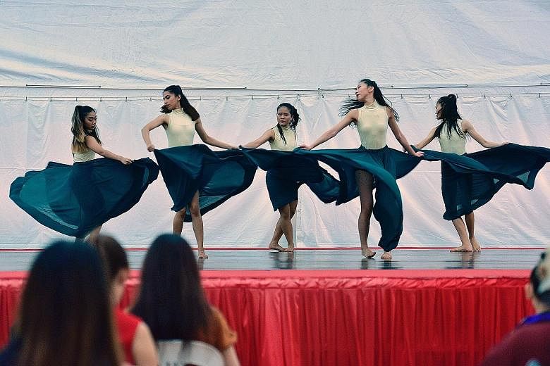 Dance students from Lasalle College of the Arts performing a routine called Sacred Connection at Ngee Ann City's Civic Plaza yesterday. They were among several local dance groups to take the stage as part of Music-In-The-City, a monthly showcase of y
