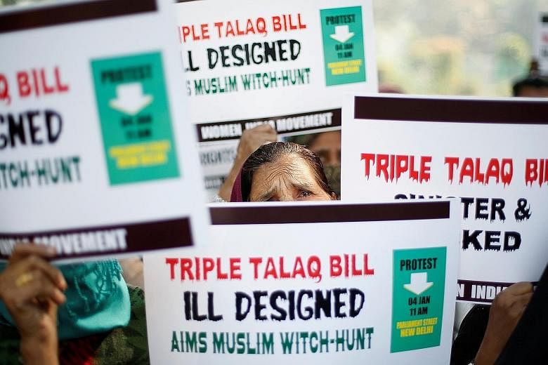 Muslim women protesting in New Delhi on Jan 4 against a government move aimed at prosecuting Muslim men who divorce their wives through the "triple talaq".