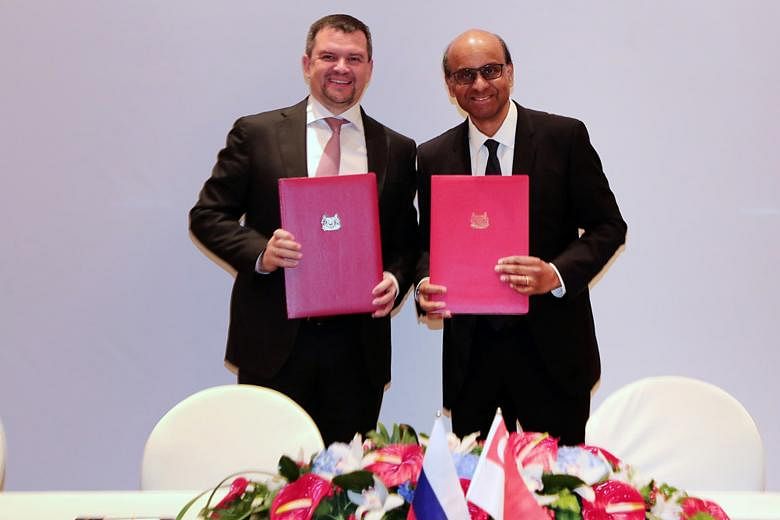 Deputy Prime Minister Tharman Shanmugaratnam and Russian DPM Maxim Akimov (left) at the high-level bilateral dialogue.