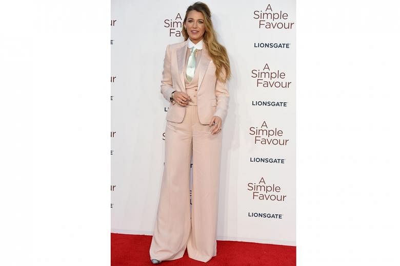 It suits her to a T, said actress Blake Lively, defending her choice of a suit to promote her latest movie, A Simple Favour, at its British premiere in London on Monday. Responding to snide comments over her fashion picks, she wrote on Instagram: "Wo