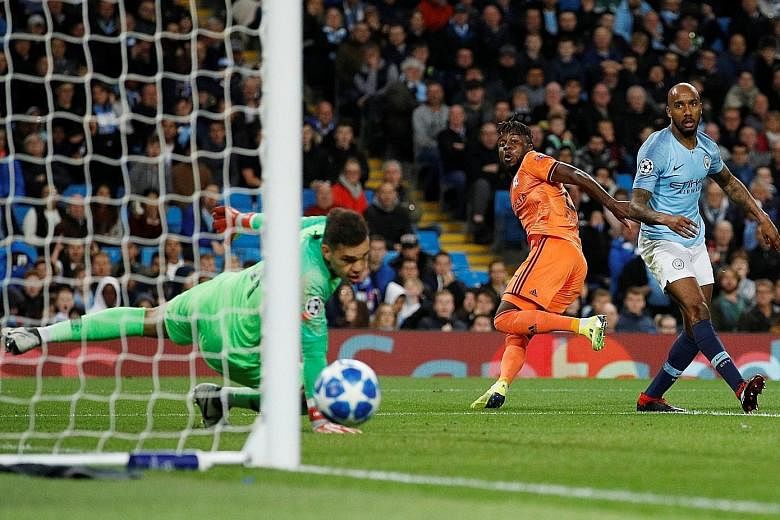 Lyon forward Maxwel Cornet (in orange) wheeling away in delight after opening the scoring for the French Ligue 1 team against Manchester City in their Champions League Group F opener at the Etihad Stadium on Wednesday.