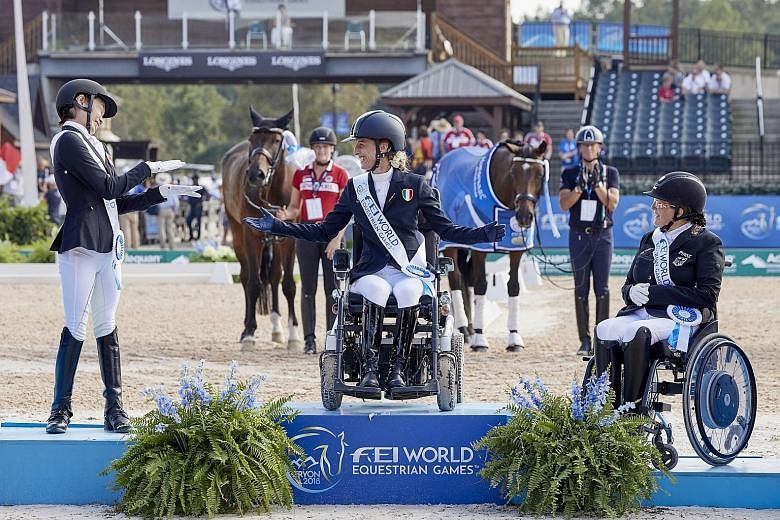 Above: Laurentia Tan, with her gelding Fuerst Sherlock, competed in the para-dressage individual championship grade I event at the World Equestrian Games in Tryon, North Carolina, on Wednesday. Left: Tan, who has one silver and three bronze medals fr