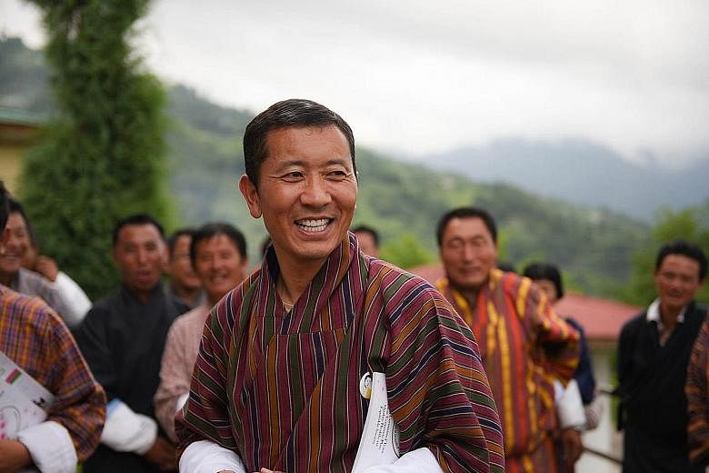 Bhutan's ruling party, led by PM Tshering Tobgay (above), lost in the polls. The most votes went to the party led by Dr Lotay Tshering (left).