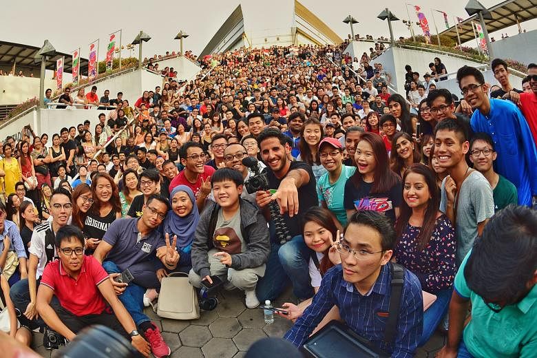 Mr Nuseir Yassin (in front row, wearing a black T-shirt) with his online followers outside the Singapore Indoor Stadium last month.