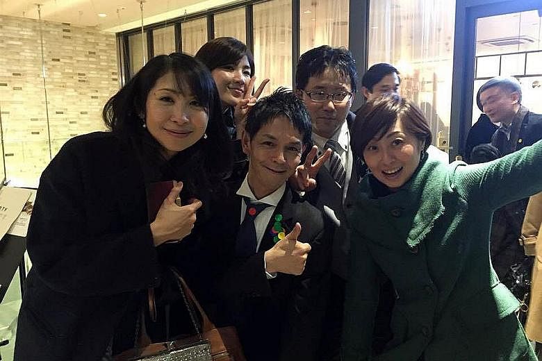 Mr Nobuaki Tanaka (centre, in black tie), 48, an "ossan" for rent, was once "rented" as a party companion.