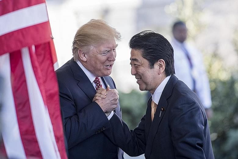 Japanese Premier Shinzo Abe, seen here with President Donald Trump at the White House in February last year, is set to hold talks with Mr Trump in New York next Wednesday amid concerns that the US could follow through on threats of further tariffs on