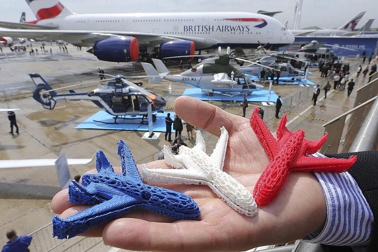 Aeroplane models (left) printed with 3D technology. The aerospace industry in Singapore wants to tap this technology, which will allow components to be produced in a single piece, instead of having to assemble different parts.