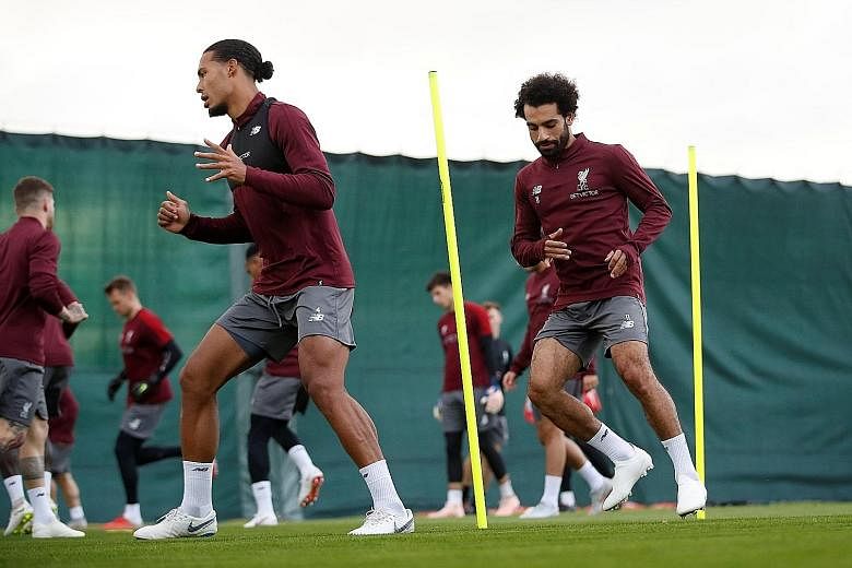 Liverpool's defender Virgil van Dijk (far left) and fellow "defender" Mohamed Salah during training in midweek. Manager Jurgen Klopp said that "on the defensive side, (Salah) was outstanding in the last two games... That says everything about him, th