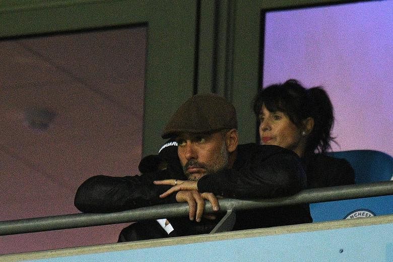 Manchester City's Spanish manager Pep Guardiola cutting a disconsolate figure from the stands during the Champions League match against Lyon at the Etihad Stadium on Wednesday, when the visitors won 2-1.