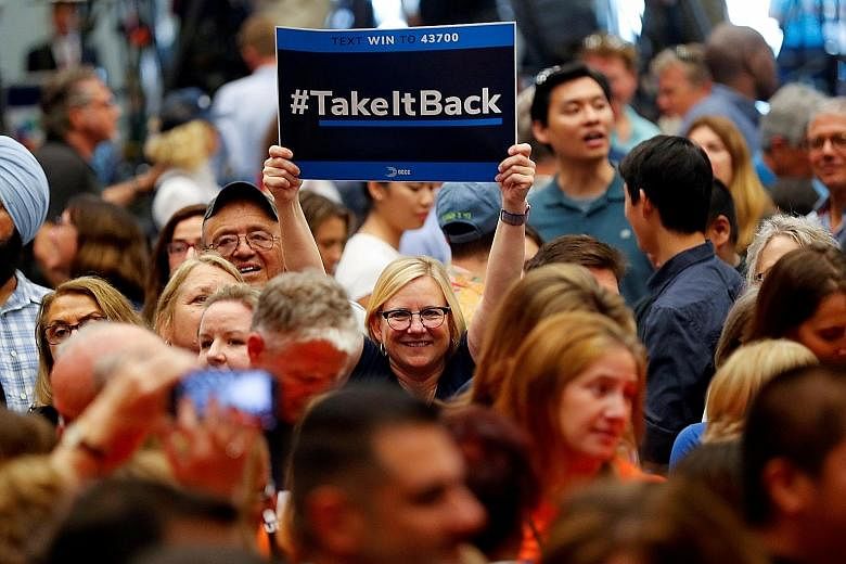 Supporters at a political rally with former president Barack Obama for Democratic California candidates in Anaheim, California, on Sept 8. Democrats are expected to take back the House of Representatives in the mid-terms.