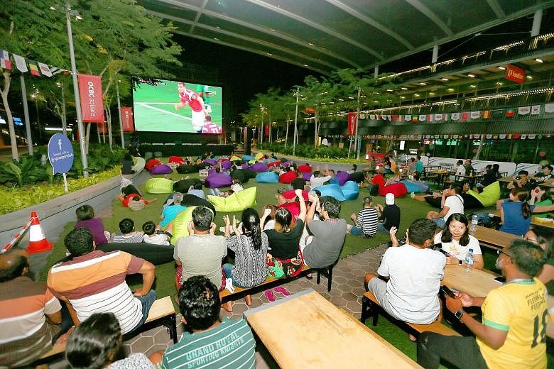 A live telecast of a World Cup match in June at the Sports Hub. Last week, however, soccer fans were left on the edge of their seats while waiting to see if Singtel and StarHub would beam the Champions League and Europa League group stages live.
