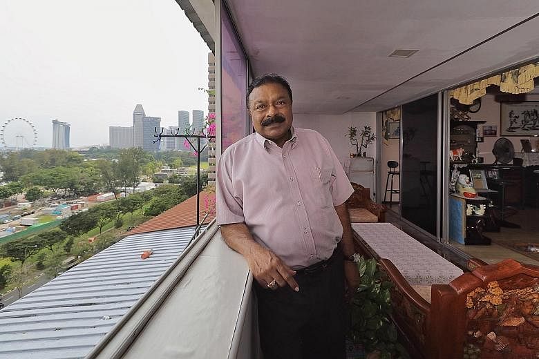 Above: Mr Ponno Kalastree, 71, says his apartment at Golden Mile Complex is a good spot to enjoy fireworks and the light shows of the Supertrees at Gardens by the Bay. Below: The stepped terrace building was originally meant to herald a new era for t