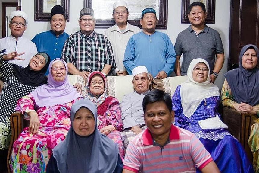 Mr Kassim and Madam Tuminah (seated in the middle of the sofa) with their 12 children. Having many children has helped to bond the family for Haji Kassim Sultan, 98, and Hajah Tuminah Haji Siraj, 88. They have been married for 73 years.