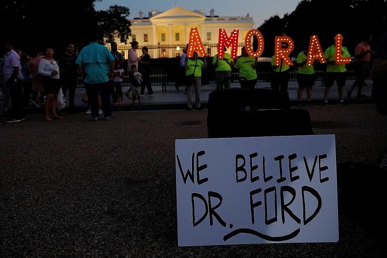 Protesters outside the White House last week with a sign supporting Dr Christine Blasey Ford, who has accused Judge Brett Kavanaugh (above), President Donald Trump's Supreme Court nominee, of sexually assaulting her in the 1980s when they were teenag