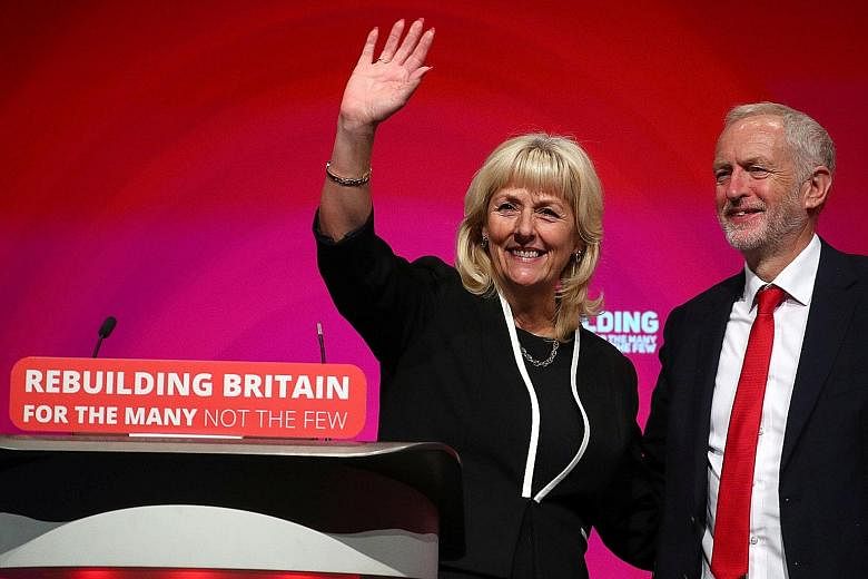 Labour general secretary Jennie Formby and party leader Jeremy Corbyn at the party conference in Liverpool yesterday. The party is split over Brexit and Mr Corbyn is trying to balance the debate to prevent alienating voters he would need to win an el