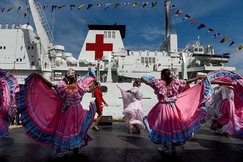 Venezuelan dancers welcoming Chinese naval medical ship "Peace Ark" at the La Guaira port on Saturday. During the vessel's eight-day stay, its commander would visit military and political officials and inspect Venezuelan military and medical faciliti