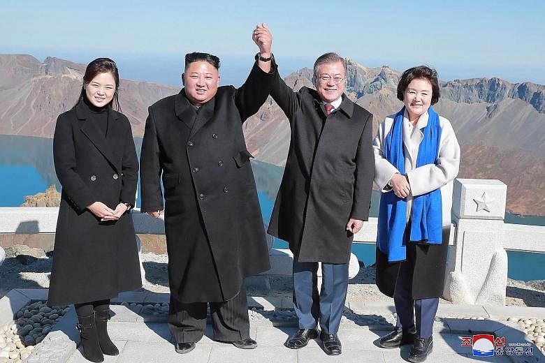 North Korean leader Kim Jong Un (second from left) and his wife Ri Sol Ju (left) with South Korean President Moon Jae-in and his wife Kim Jung-sook on the top of the sacred Mount Baekdu on Sept 20 after their summit in Pyongyang.