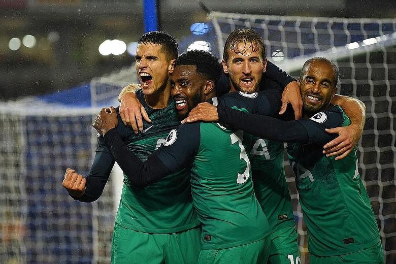 Erik Lamela (left) celebrating scoring Tottenham's second goal with (from right) Lucas Moura, Harry Kane and Danny Rose. Spurs returned to winning ways against Brighton after three straight defeats.