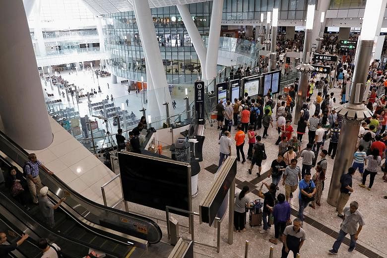 West Kowloon station packed with people on the first day of the express rail service. The project has generated some controversy as mainland officers have almost full jurisdiction over a 105,000 sq m area designated as a mainland port zone in the ter