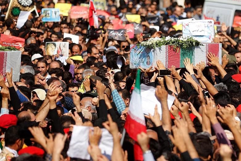 Thousands of people packed the streets of Ahvaz yesterday to mourn the victims of an attack on a military parade in the Iranian city last Saturday. The coffins, wrapped in the flag of the Islamic Republic, were carried through the streets by the mour