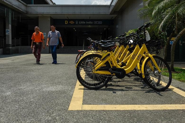 Bicycles parked neatly within the parking space outside Little India MRT station yesterday. To make sure that users park their shared bicycles properly, the Land Transport Authority said that it will start installing QR codes at such public bicycle p