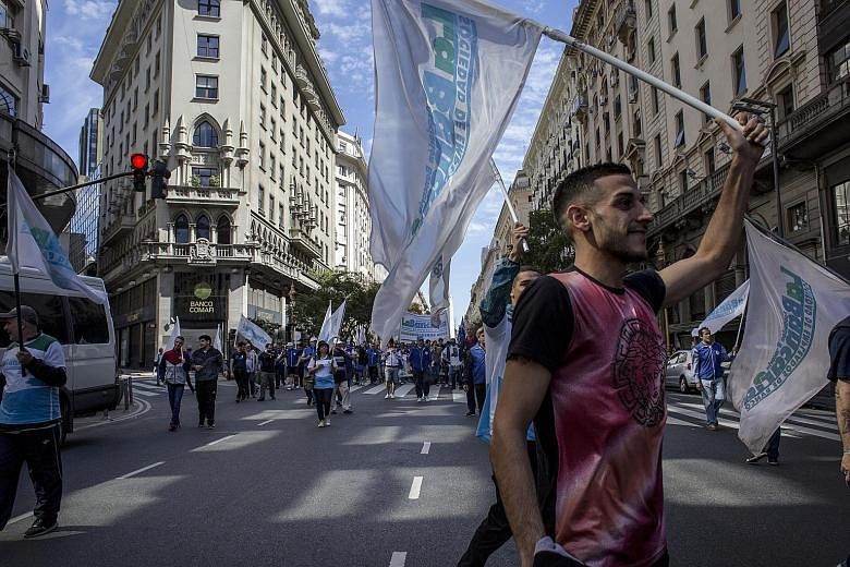 People in Buenos Aires on Tuesday protesting against runaway inflation and austerity measures imposed by President Mauricio Macri to shore up government finances. Argentina's peso has lost over half of its value so far this year, amid worries about t