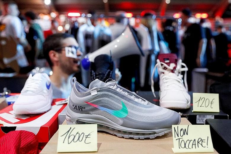 Nike shoes on sale in Rome. Its model of selling directly to consumers helped sales in North America climb 6 per cent, its second straight rise, showing signs of recovery after competition from rivals eroded sales in three out of the last four quarte