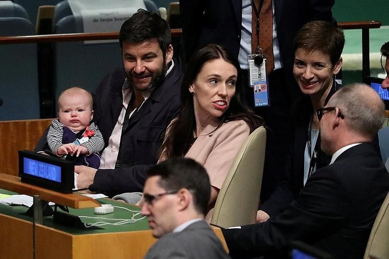 New Zealand Prime Minister Jacinda Ardern with her baby daughter Neve (in the arms of her partner and television show host Clarke Gayford) after speaking at the Nelson Mandela Peace Summit at the UN on Monday.