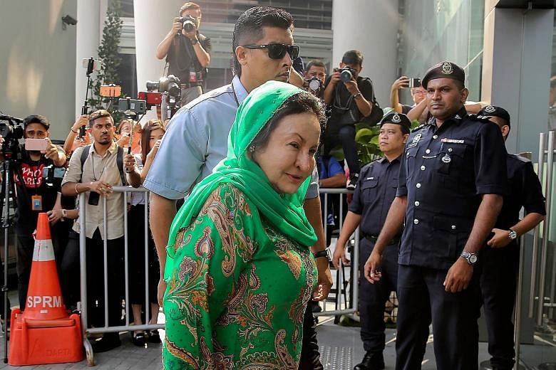 Datin Seri Rosmah Mansor, the wife of former Malaysian prime minister Najib Razak, arriving at the headquarters of the Malaysian Anti-Corruption Commission (MACC) yesterday morning. Madam Rosmah, who was accompanied by her lawyer, left the complex af
