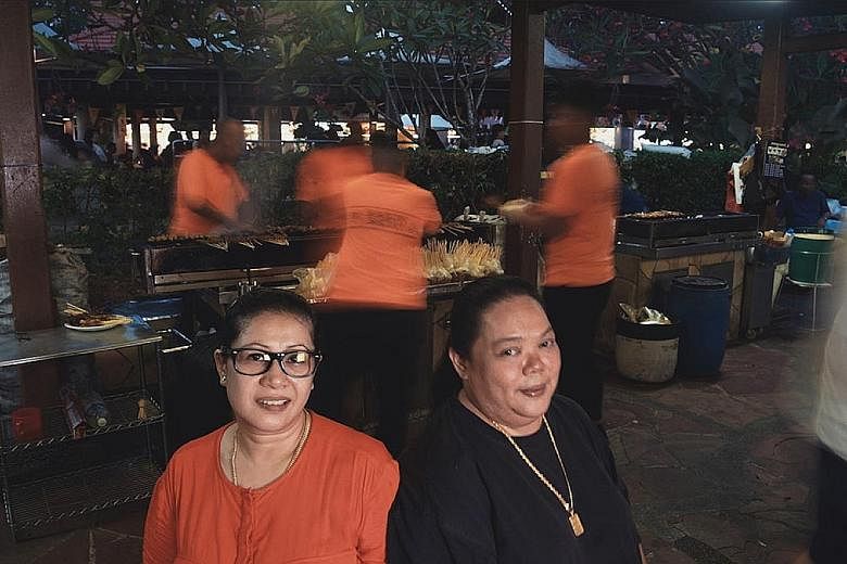 Sisters Shima Salim (left) and Harlina Haron took over their father's business in 2009. Haron Satay in East Coast Lagoon Village was named a Singapore Hawker Master by The Straits Times and Lianhe Zaobao.
