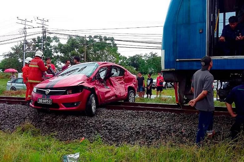 This Proton Preve car collided with a train in rainy weather at a rail crossing near Petagas township in Kota Kinabalu and was dragged for about 200m, along with the two men inside.