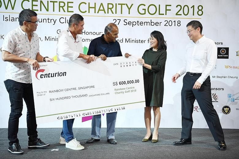 Above: (From left) Centurion Group principals David Loh and Han Seng Juan, and Home Affairs and Law Minister K. Shanmugam presenting a cheque to Rainbow Centre Singapore executive director Tan Sze Wee and vice-president Chew Kei-Jin. Right: (From lef