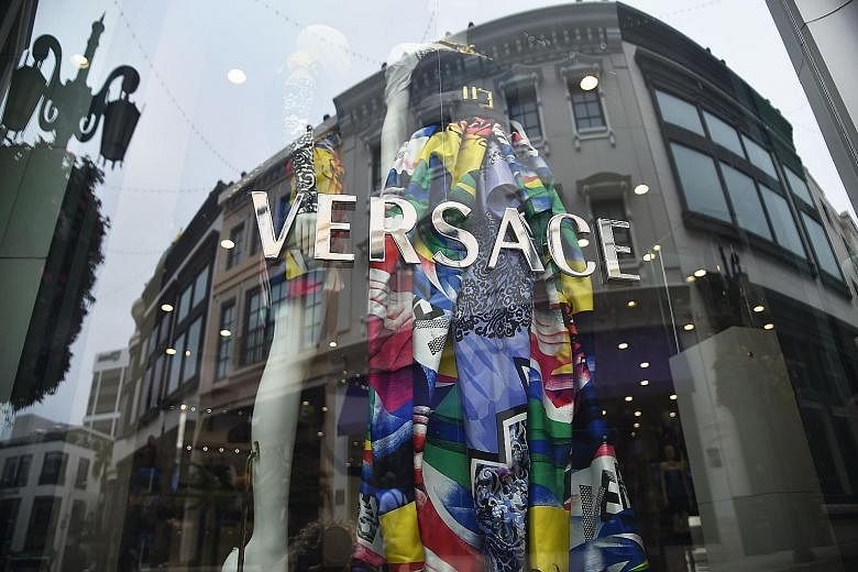 Michael Kors will look to grow Versace's (above) sales of accessories like handbags, leather goods and shoes.