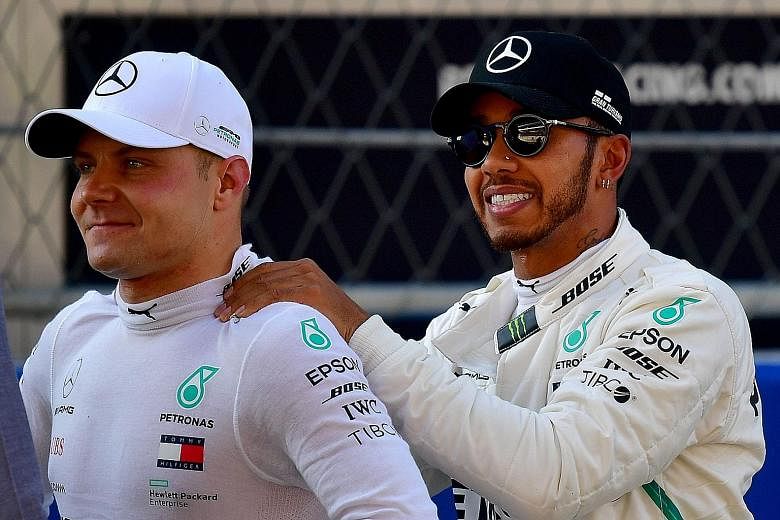 Mercedes pair Valtteri Bottas (left) and Lewis Hamilton after qualifying for the Russian Grand Prix yesterday. Bottas claimed his sixth career pole and will start ahead of his teammate.