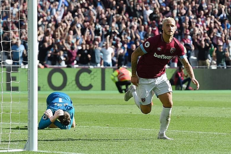 West Ham's Marko Arnautovic celebrates after scoring the third goal in his side's 3-1 Premier League win over Manchester United yesterday. United's 10 points after their opening seven games of a top-flight season is their lowest since the 1989-90 cam