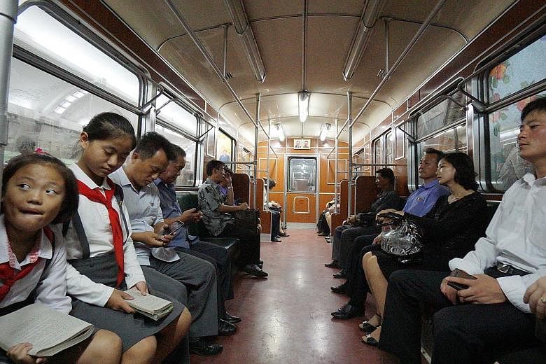 Commuters riding the Pyongyang Metro, which can double as a nuclear bunker and is said to be the world's deepest underground subway system, last Sunday.