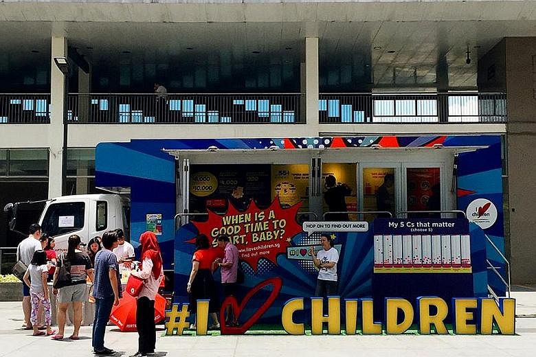 I Love Children's Truck-on-the-Go, which educates visitors on managing one's finances and understanding fertility issues, at Hillion Mall last Saturday. It will make more stops in more areas this and next month.
