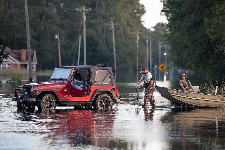 Flooding caused by Hurricane Florence in Bucksport, South Carolina, last week. The United States' strong economic performance could be dented by extreme weather like Hurricane Florence, which could hobble job creation in the affected regions.