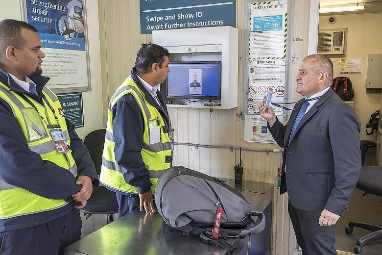 Staff of SNP Security, which was acquired by Certis earlier this year, screening checked bags for threats before the luggage is loaded onto planes at Sydney Airport. SNP has contracts with seven Australian airports.