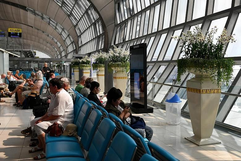 Passengers at Suvarnabhumi Airport in Bangkok. The number of flights could triple to more than 20,000 a day in 15 years, says the UN's International Civil Aviation Organisation.