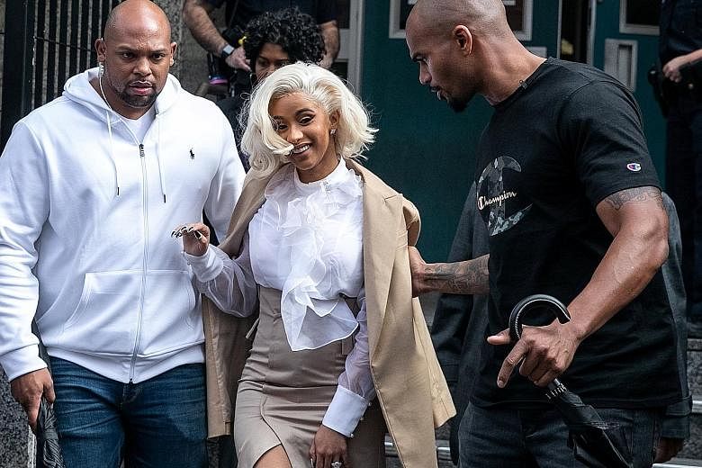 Rapper Cardi B leaving a police station in Queens, New York on Monday. She turned herself in after a brawl in a strip club.