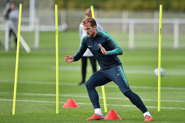 Tottenham striker Harry Kane, training at the club's Enfield Training Centre, will be relied upon to lead the line against Barcelona when the two sides play at Wembley in their Champions League game. Spurs are hoping to bounce back from their opening