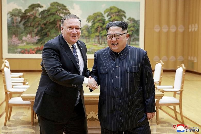 US Secretary of State Mike Pompeo (far left) meeting North Korean leader Kim Jong Un earlier this year. The US diplomat will be in Pyongyang on Sunday for another meeting with Mr Kim.